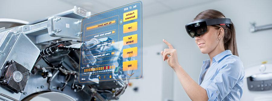 Engineer inspecting an engine through augmented reality